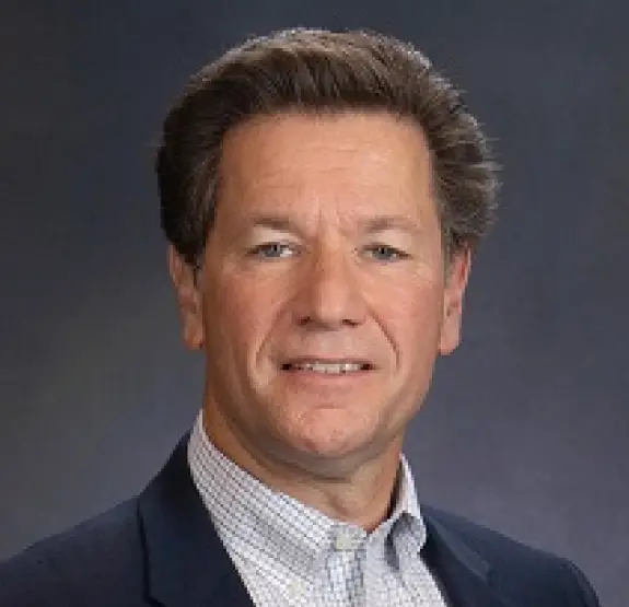 A headshot of the Chief Commercial Officer, George Kostopoulos, from the company leadership team