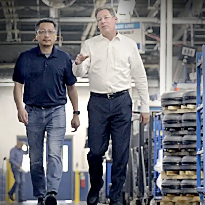 Two members of our company leadership team walking through the remanufacturing plant